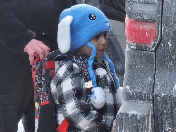Five-year-old Liam Ramos with an ICE agent in Minneapolis