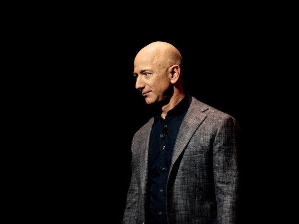 Jeff Bezos standing in profile