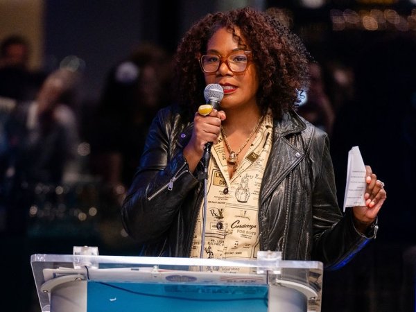 Brandi Collins-Dexter speaking into a microphone