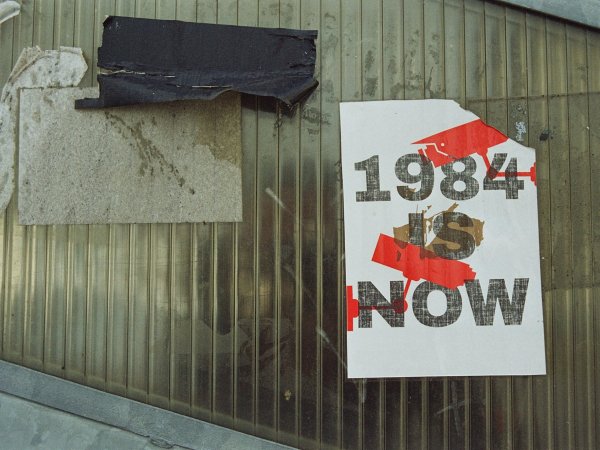 A poster reading "1984 Is Now"