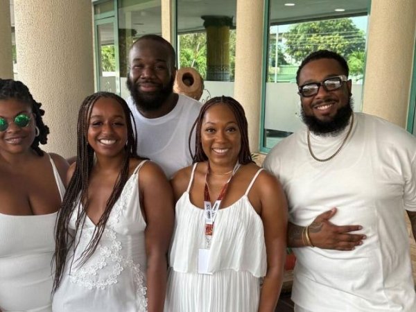 Free Press staffers Venneikia Williams and Diamond Hardiman standing with fellow participants at a reparations conference in Ghana.