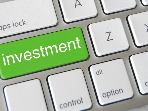 Calculator featuring the word "investment"
