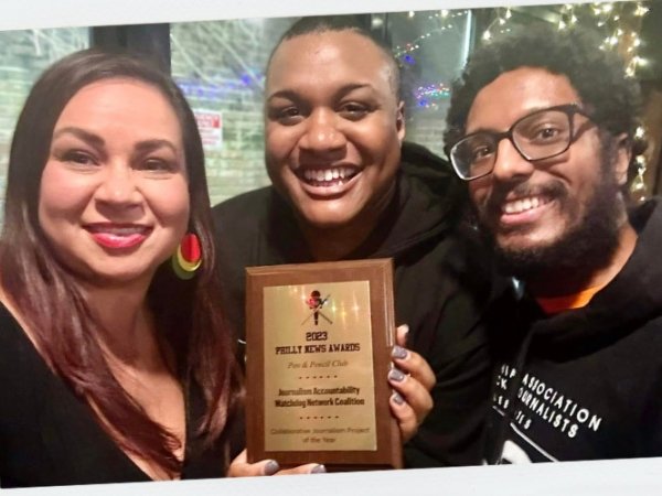 Vanessa Maria Graber, Ernest Owens and Tauhid Chappell hold the award J.A.W.N. received for Collaborative Journalism Project of the Year.