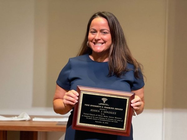 Free Press Co-CEO Jessica J. González holding the Everett C. Parker Award at the 40th annual Parker Lecture
