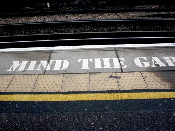 Subway platform reading "Mind the Gap"