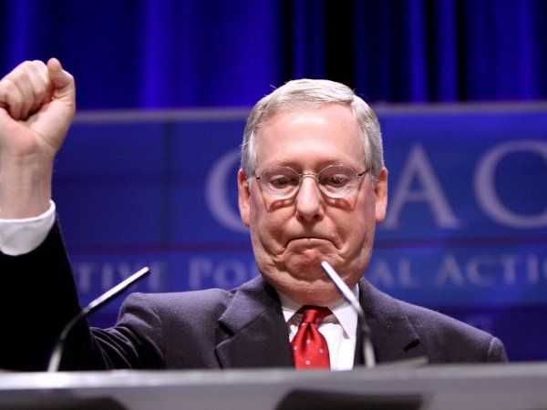 Mitch McConnell raising a fist