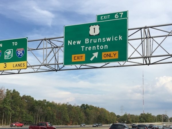 New Jersey highway with exit sign for New Brunswick and Trenton