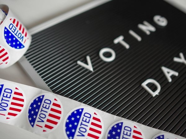 A sign reading "Voting Day" and a roll of stickers reading "I Voted"