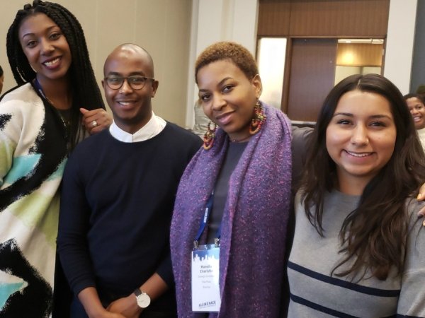 Three Free Press staffers with an ally