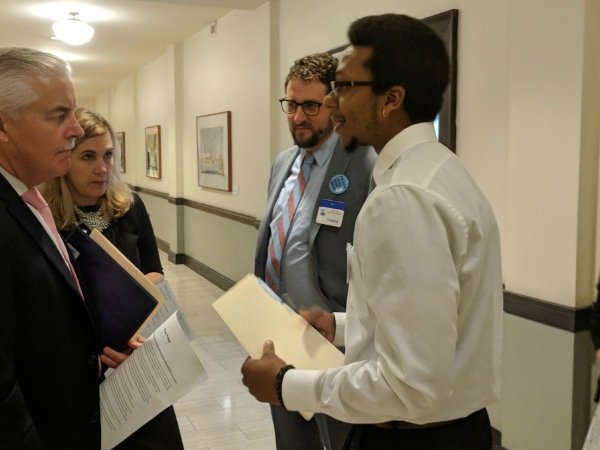 Trenton resident Julian Seward asks Assemblyman Eric Houghtaling to support the bill.