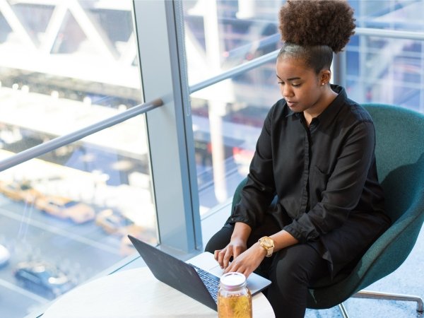 Woman typing on laptop