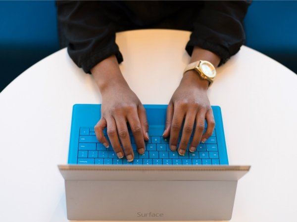 Person typing on laptop