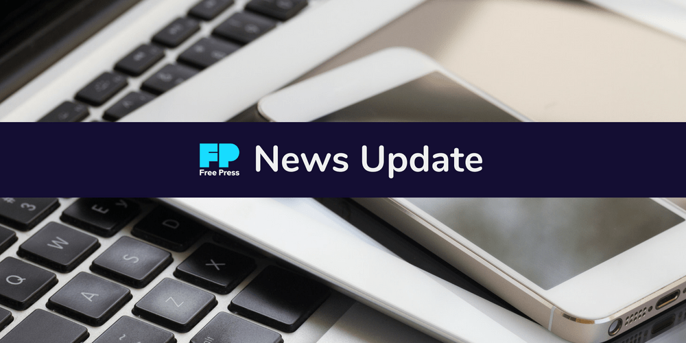 "Free Press News Update" superimposed on laptop keyboard
