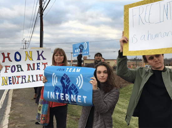 Hadley, Massachusetts protesters holding "Honk for Net Neutrality" and "Join Team Internet" signs