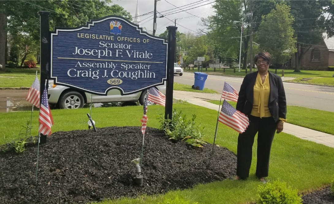 Woman outside the office of Sen. Joseph F. Vitale and Assembly Speaker Craig J. Couglin in NJ