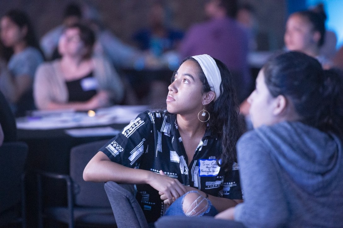 A woman listening during the event.