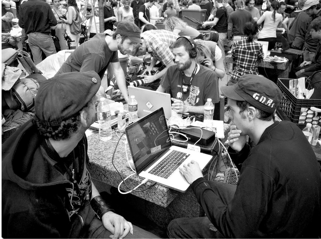 Students at Columbia University’s WKCR are continuing a long tradition of campus journalists doing essential on-the-ground reporting. Here, student livestreamers seated at a bank of computers cover the 2011 Occupy protests.