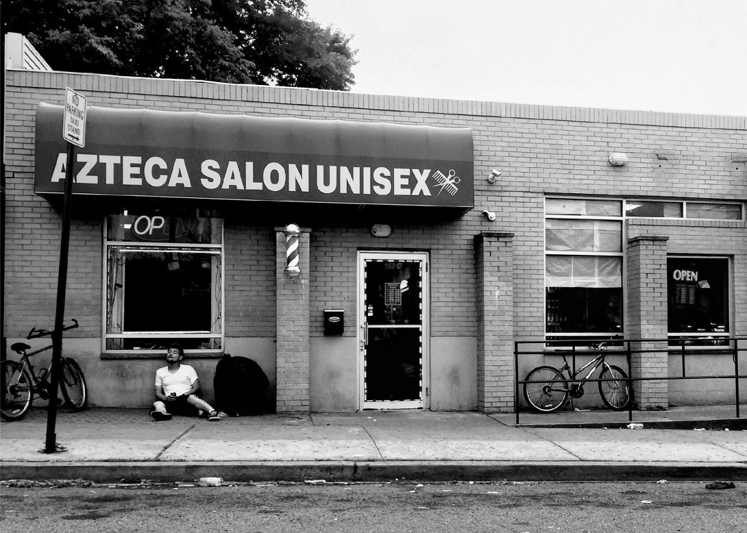 Man outside the Azteca Salon Unisex in New Brunswick
