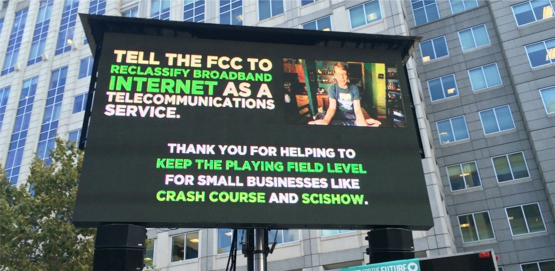Billboard urging the FCC to "reclassify broadband internet as a telecommunications service"
