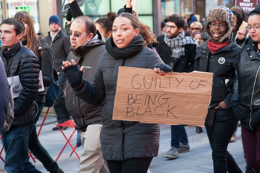 Black Lives Matter activists with the sign "Guilty of being black"