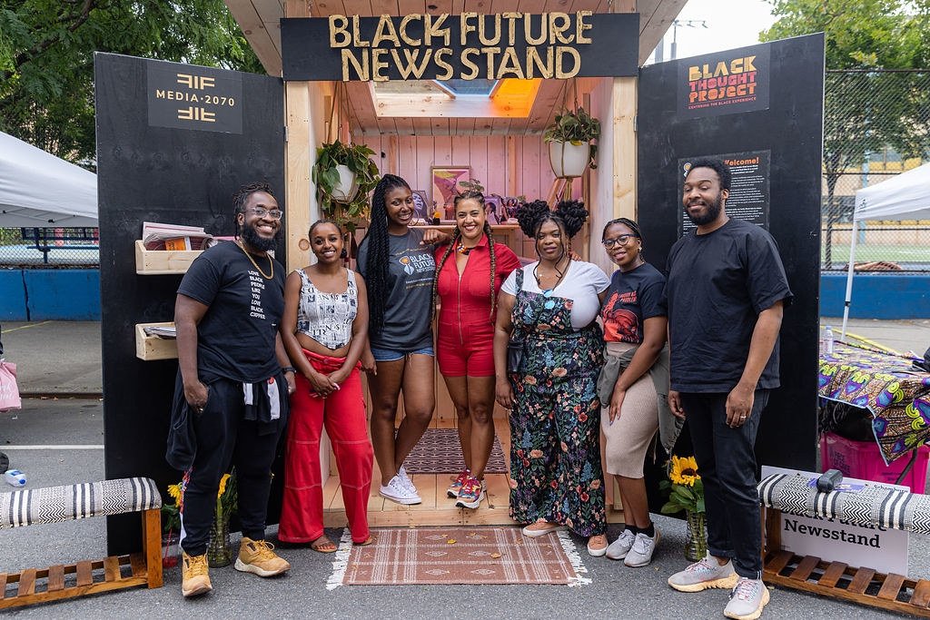 Media 2070 staff members and allies at the Black Future Newsstand installation in Harlem