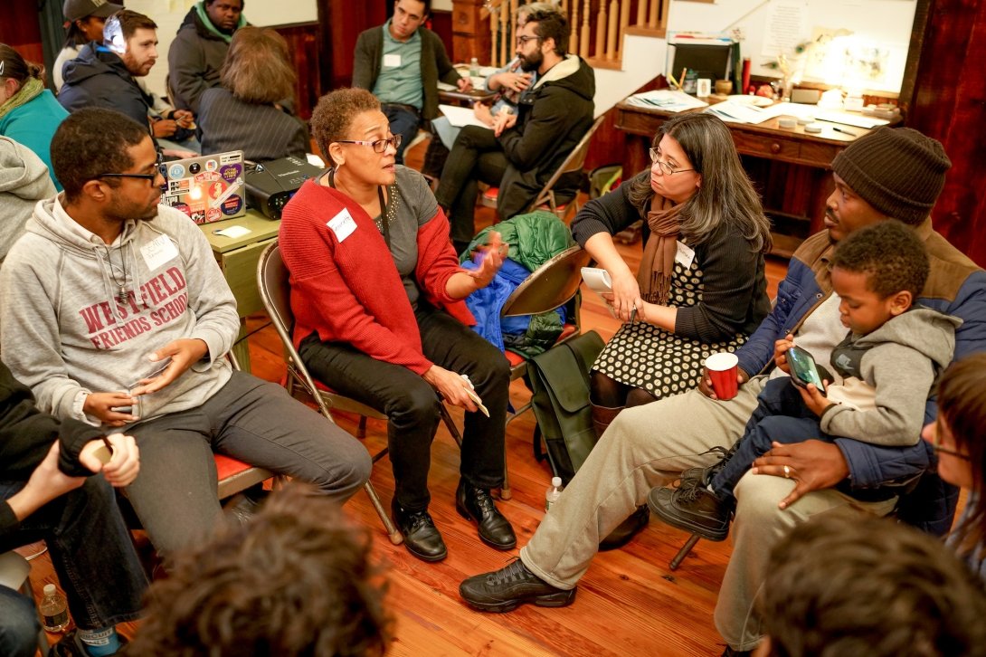 Group of people talking in a circle