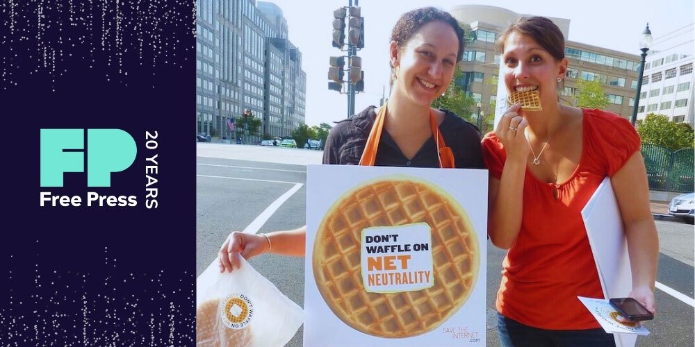 Free Press Chief of Staff Misty Perez Truedson and Free Press alum Jenn Topper holding waffles and a sign reading "Don't waffle on Net Neutrality" outside FCC headquarters