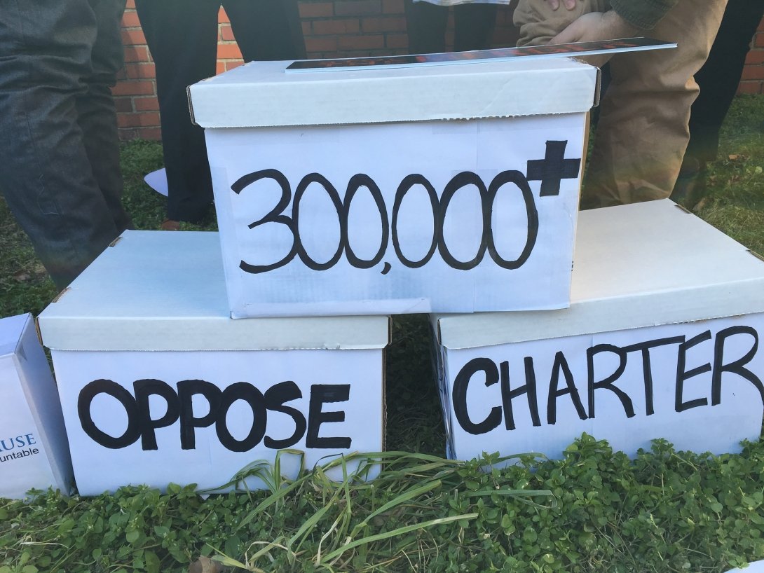 Three stacked boxes reading "300,000+ oppose Charter"