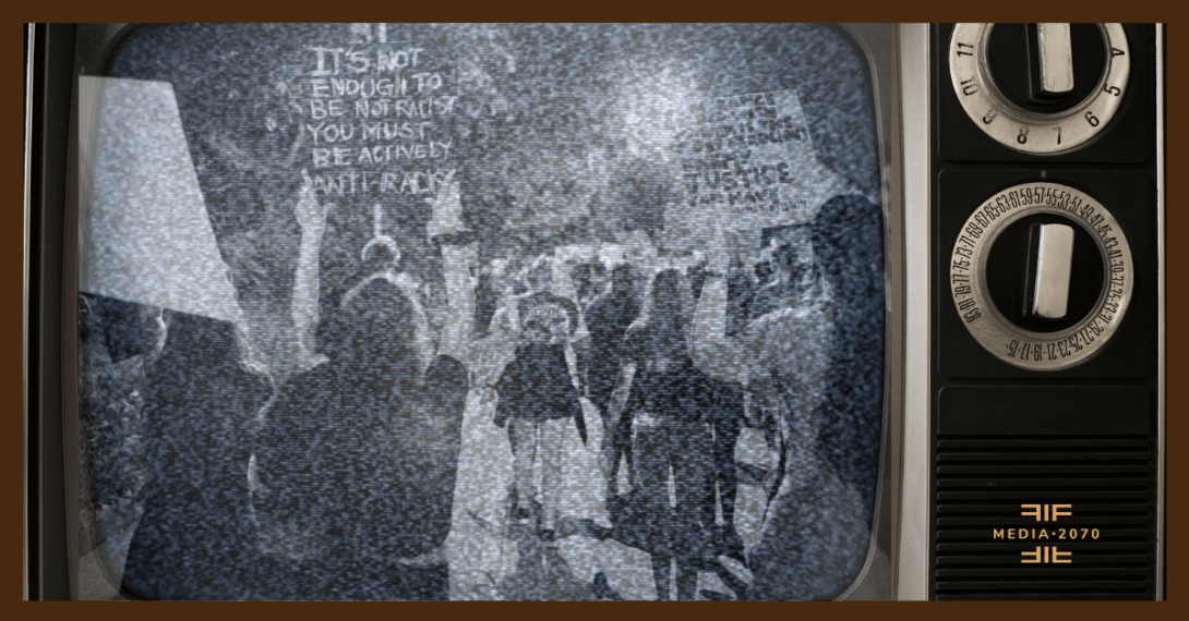 Vintage television with grainy black-and-white image of a protest