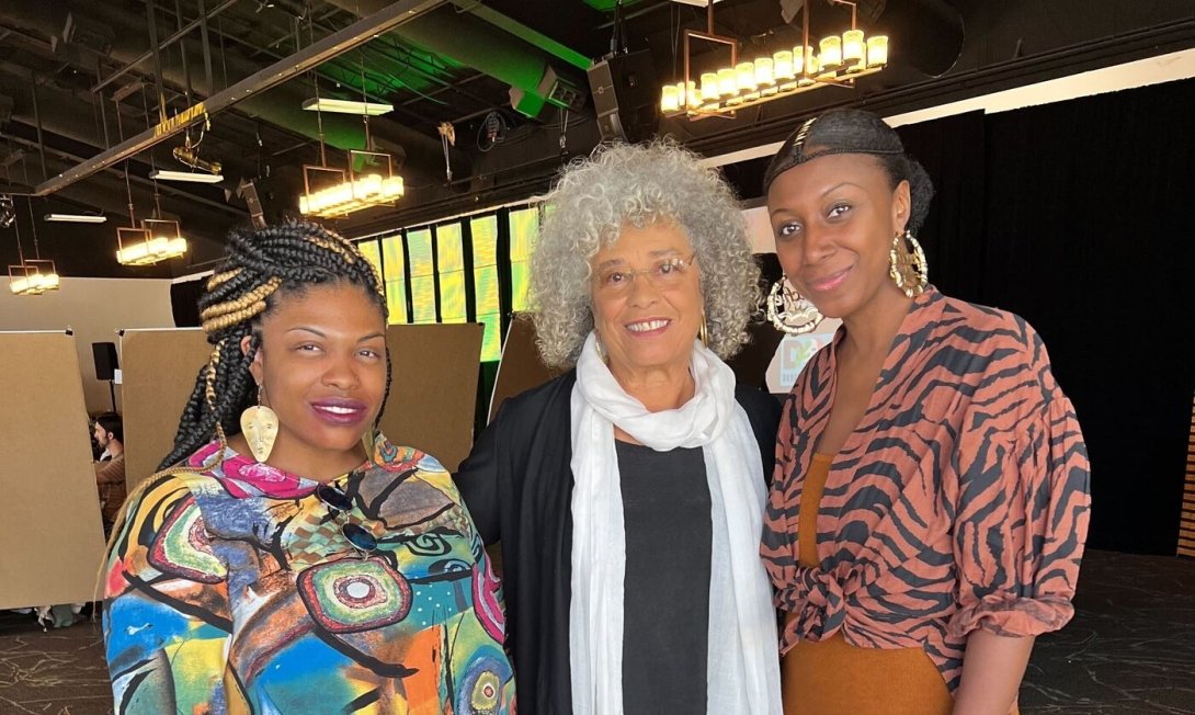 Free Press staffers Venneikia Williams and Collette Watson with Dr. Angela Davis