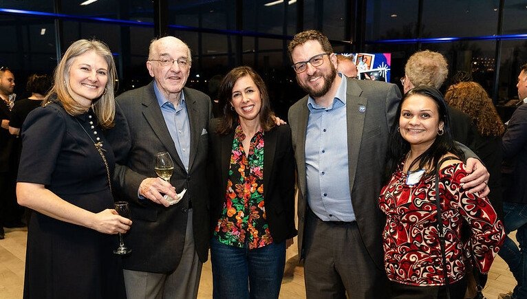 Former FCC Commissioner Michael Copps (second from left), FCC Chairwoman Jessica Rosenworcel (center) and Free Press Co-CEO Craig Aaron (second from right) with others at the Free Press 20th-anniversary party