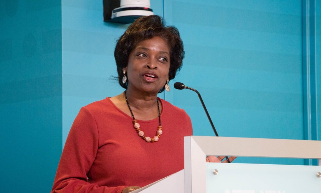 Former FCC Commissioner Mignon Clyburn speaking at a podium