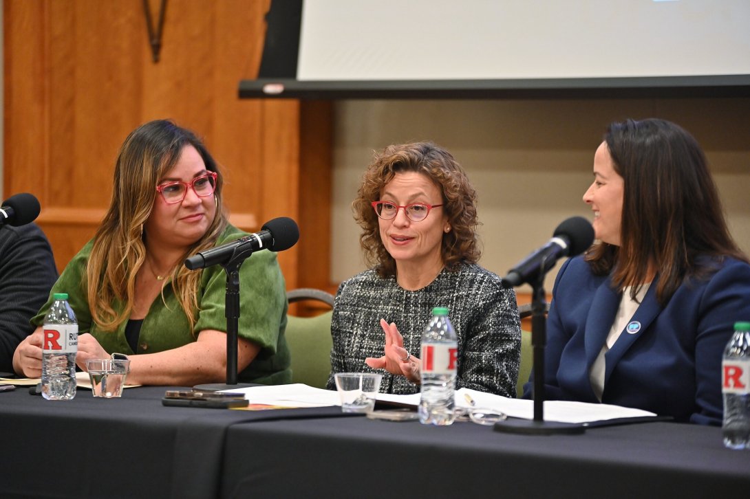 Free Press' Vanessa Maria Graber and Jessica J. González sitting on either side of FCC Commissioner Anna Gomez