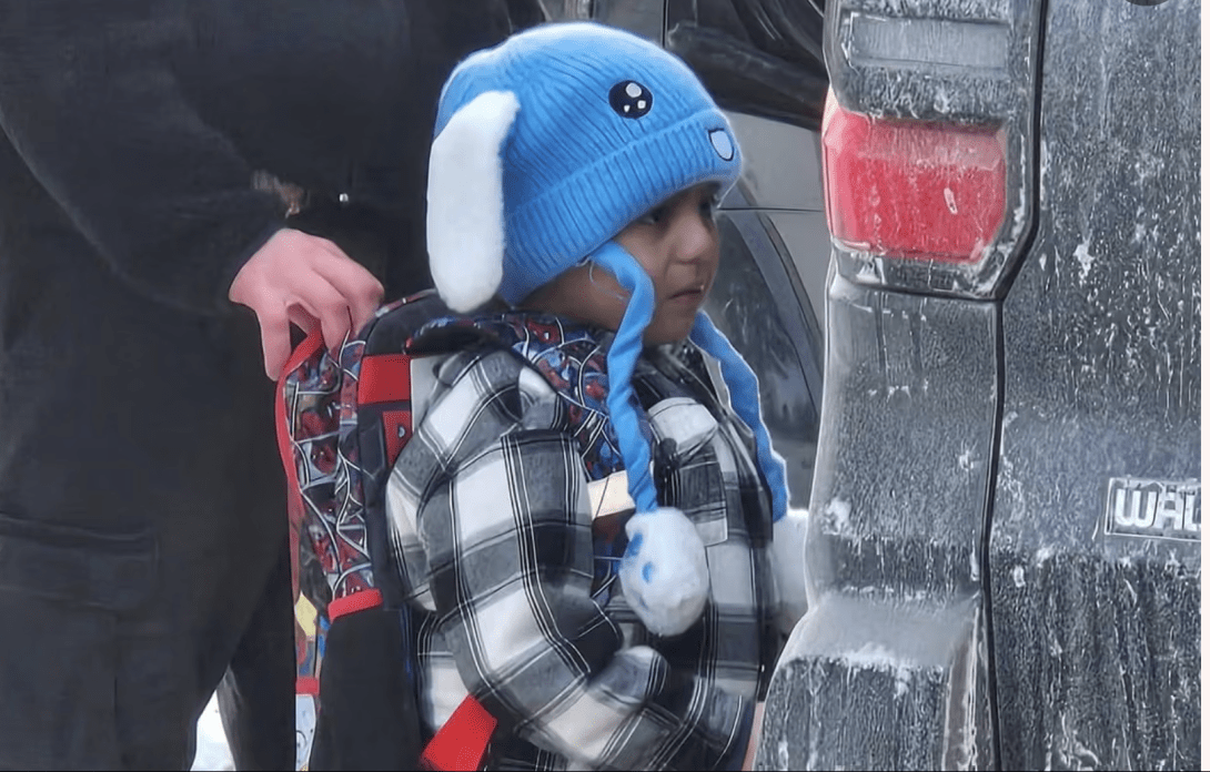 Five-year-old Liam Ramos with an ICE agent in Minneapolis