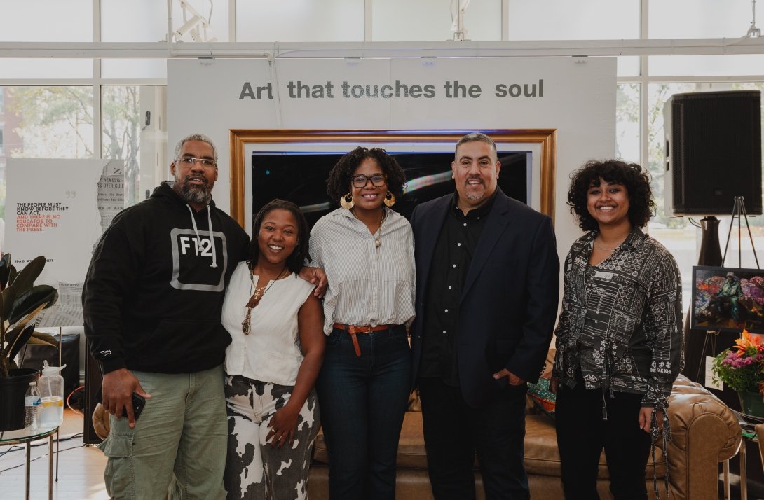 Free Press board member Brandi Collins-Dexter and Free Press' Joseph Torres flanked by allies at the Black Future Newsstand exhibit in Chicago
