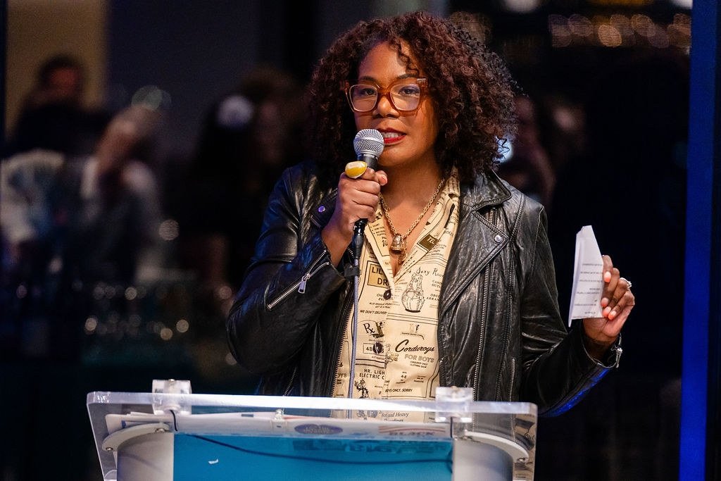 Brandi Collins-Dexter speaking into a microphone