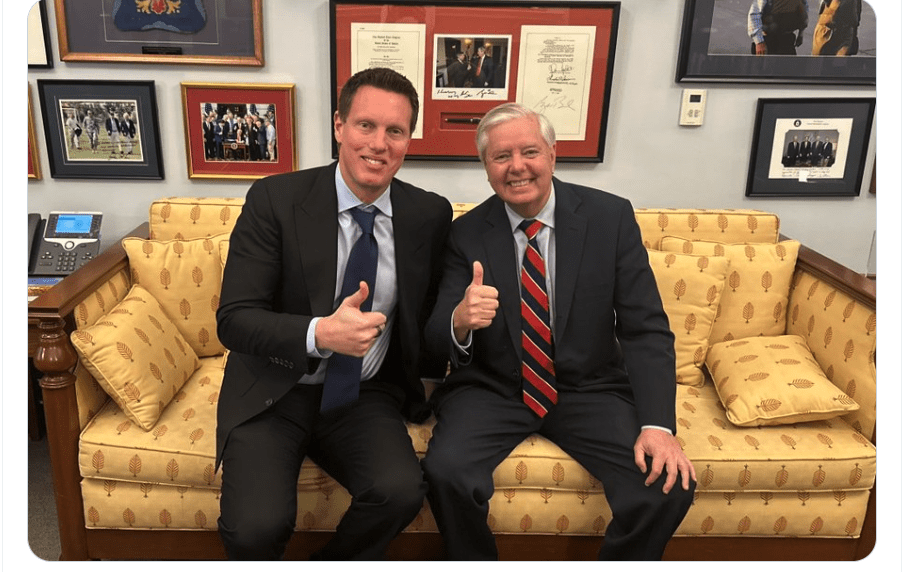 Paramount Skydance CEO David Ellison sitting with Sen. Lindsey Graham
