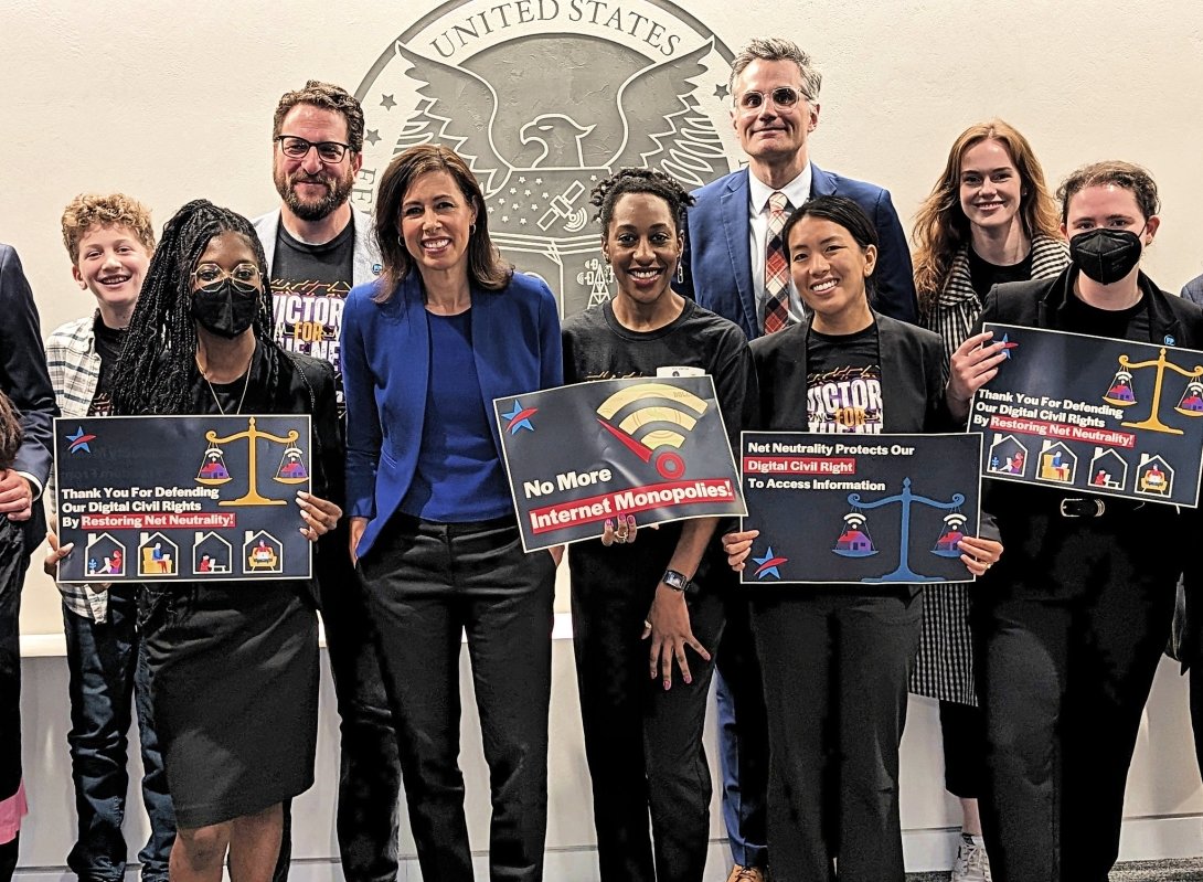 Free Press staffers, allies and FCC Chairwoman Jessica Rosenworcel (center) celebrate the Biden FCC's vote to restore Net Neutrality and Title II
