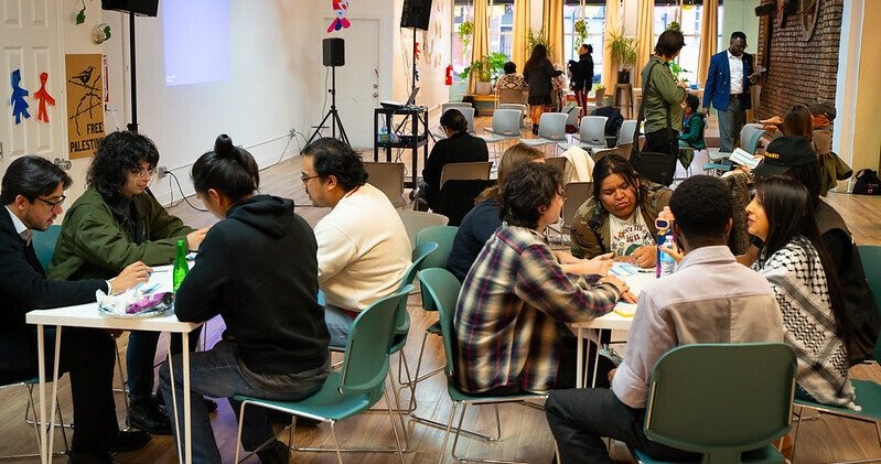 Residents of Chicago's Pilsen neighborhood discussing local news