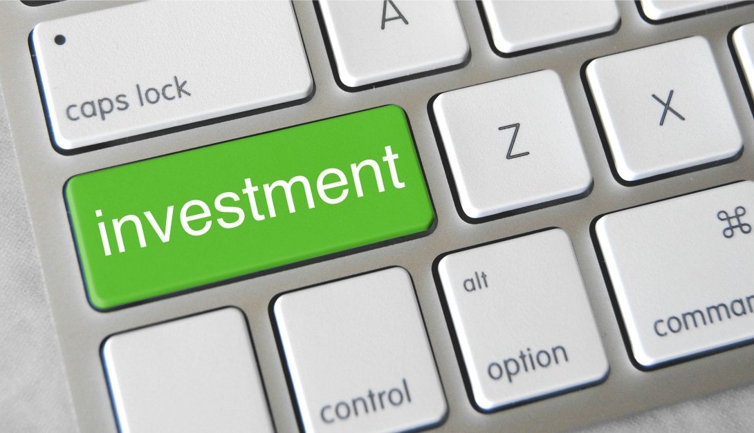 Calculator featuring the word "investment"