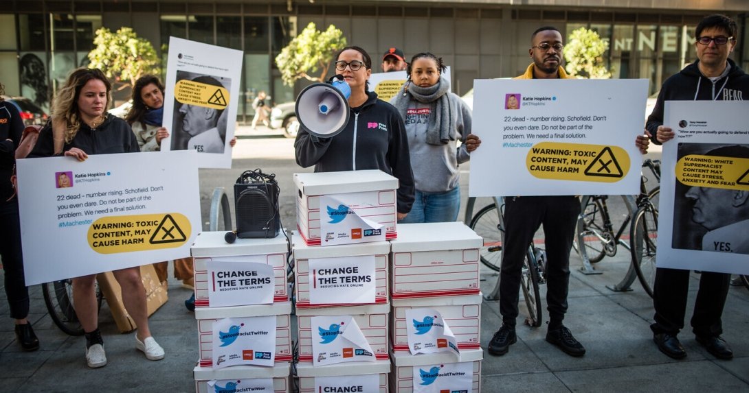 Free Press Action's Jessica J. Gonzalez speaks into a megaphone at a protest outside Twitter headquarters.