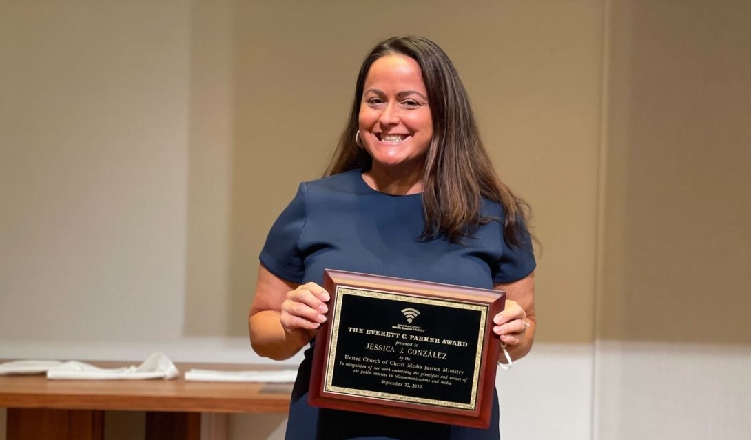 Free Press Co-CEO Jessica J. González holding the Everett C. Parker Award at the 40th annual Parker Lecture