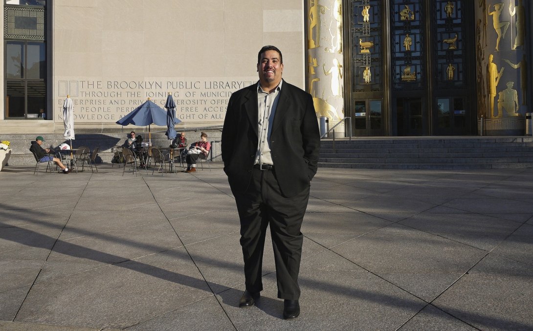 Free Press' Joseph Torres in front of the Brooklyn Public Library