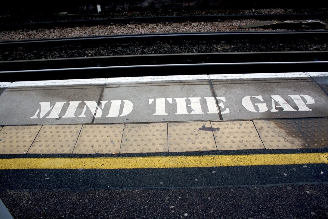 Subway platform reading "Mind the Gap"