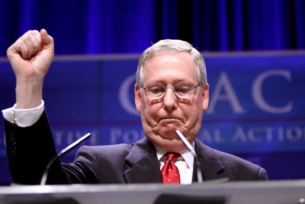 Mitch McConnell raising a fist