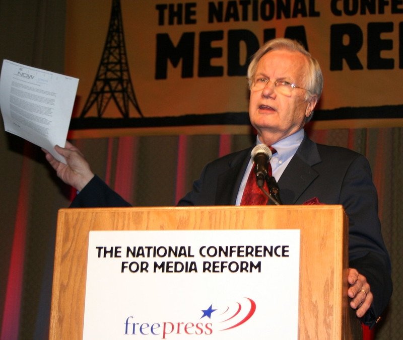 Bill Moyers speaking at a podium at the National Conference for Media Reform