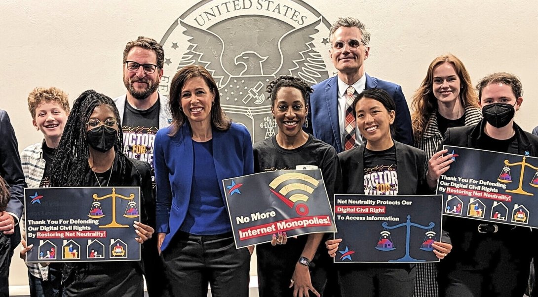 Free Press staffers and allies with FCC Chairwoman Jessica Rosenworcel (in blue) the day the agency voted to restore Net Neutrality and reinstate its Title II authority