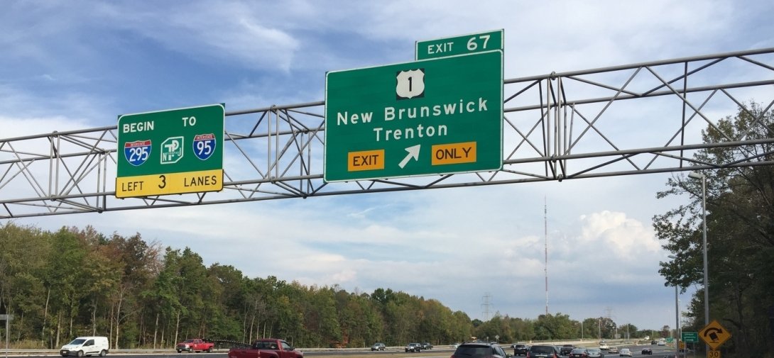 New Jersey highway with exit sign for New Brunswick and Trenton
