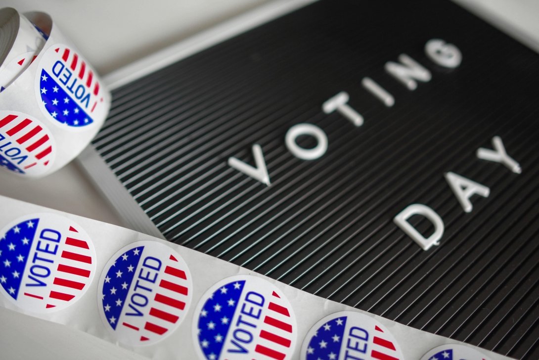 A sign reading "Voting Day" and a roll of stickers reading "I Voted"