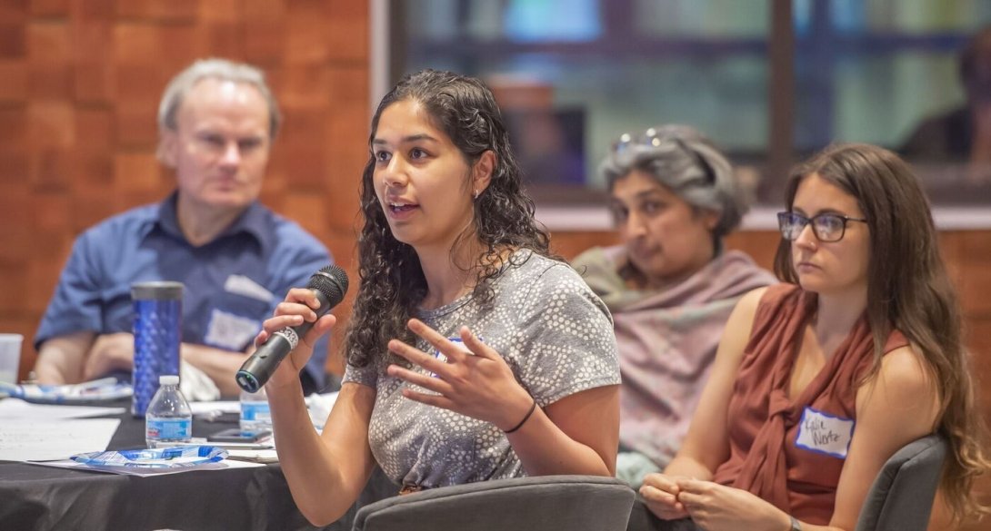 Attendee speaking at an Organizing for Neighborhood News event held earlier this year.